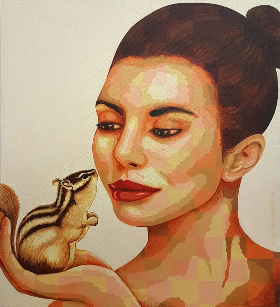 This is an original contemporary portrait painting of a rectangular shape. It is an acrylic on canvas artwork with a light ocher background. In the center, and occupying the majority of the canvas, is the face of a beautiful young woman with her head at a slight angle. She gently holds a charming squirrel in the palm of her hand. They are both looking at each other and the love and affection between them is heartwarming. The lady has a gentle smile on her face. She is covered in my signature style of checks in subtle, contrasting hues of peach and ocher. The realistic squirrel is in its natural coloursThis artwork is from my series "In Harmony with Nature" Through this painting, I aim to capture the awe-inspiring connection between humans and the exquisite tapestry of nature that envelops us. It’s our responsibility to be compassionate towards all living creatures around us and live in harmony with nature. Lady and Squirrel, portrait painting artists, art painting shop near me, artwork painting, art originals for sale