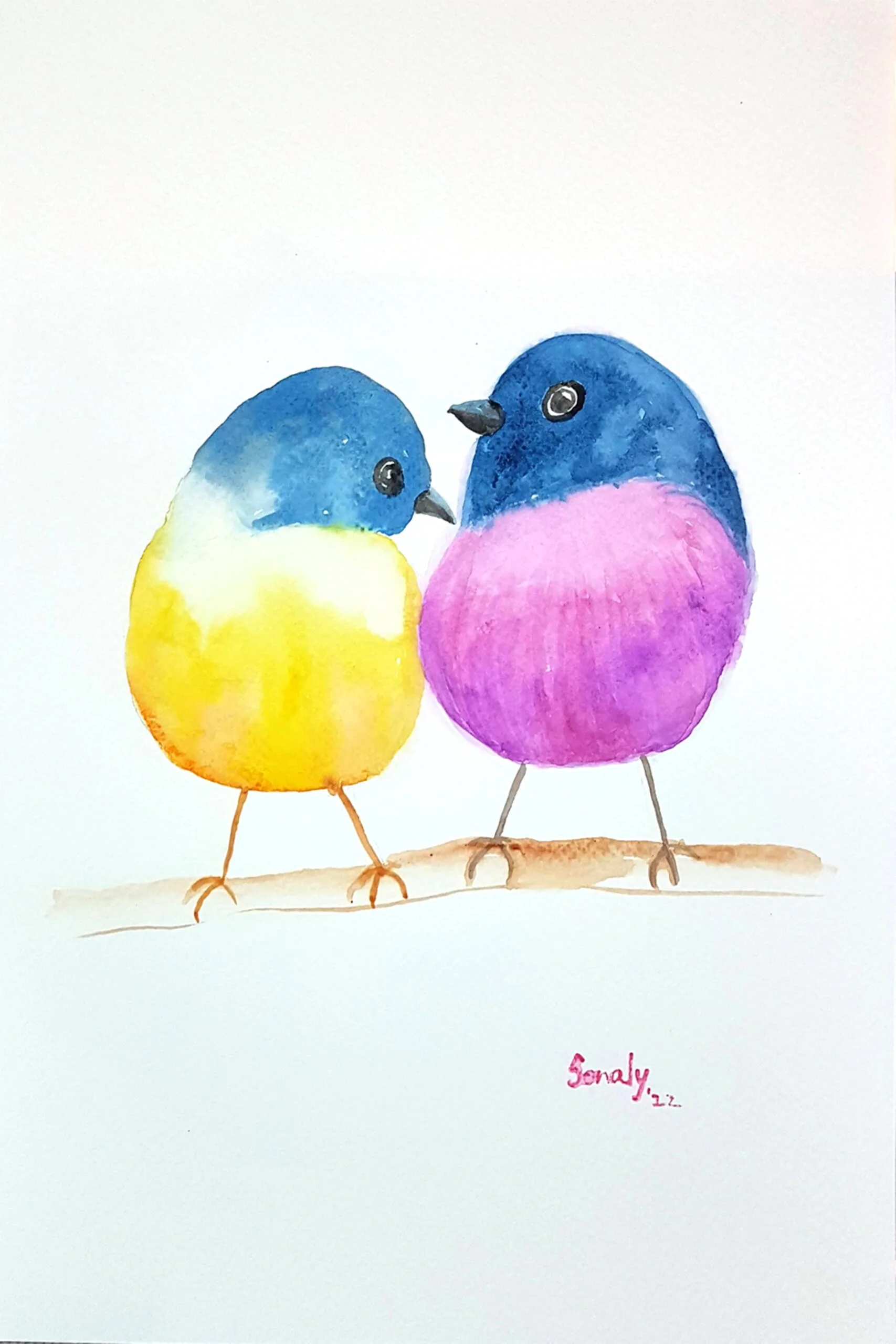 This is an original minimalist watercolor on paper painting of a rectangular shape. This artwork titled "Love Birds" has a white paper background with a beautiful pair of Love Birds sitting on the branch of a tree, in the center, occupying most of the composition. Painted in bright, and vibrant hues of blue, brown, yellow, purple, and more, the painting is well-balanced and very attractive. This artwork is from my watercolour series called "Birds". The fluidity of this medium offers a unique opportunity for me to let go and strike a balance between control and freedom, resulting in astonishing effects and outputs. Love Birds, bird prints, paintings for bedroom, new artwork, original paintings for sale