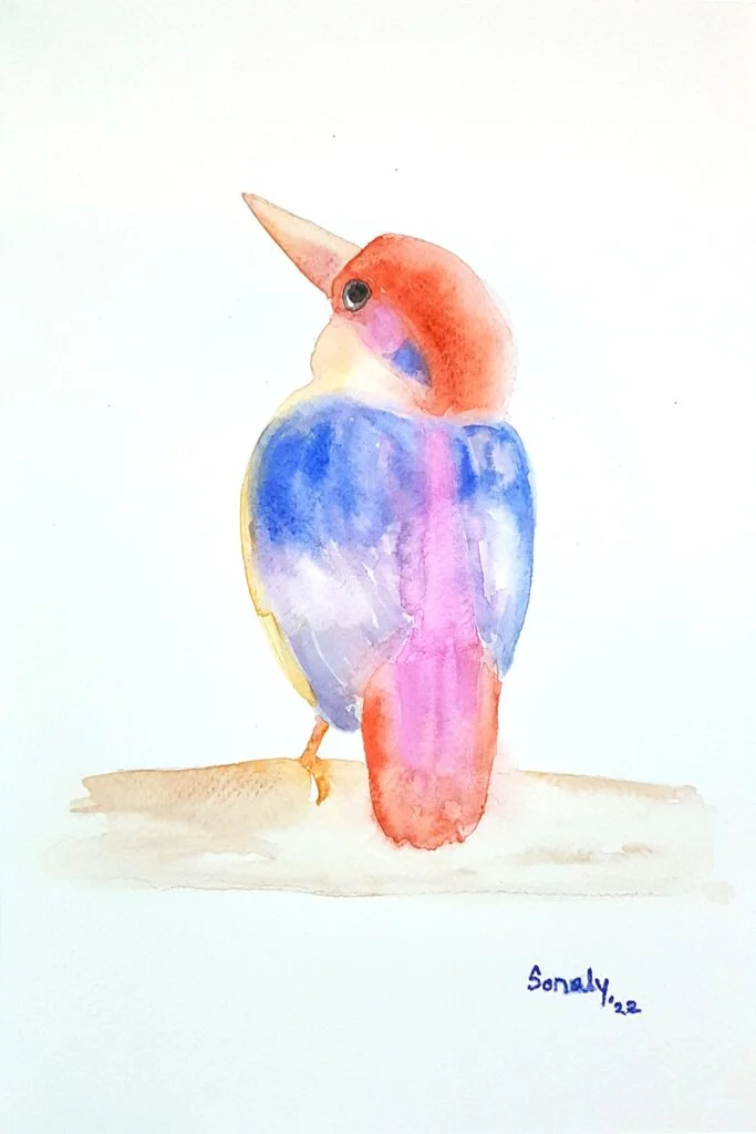 This is an original minimalist watercolor on paper painting of a rectangular shape. This artwork titled "Kingfisher" has a white paper background with the beautiful Kingfisher Bird sitting on the branch of a tree, in the center, occupying most of the composition. Painted in bright, and vibrant hues of blue, brown, red, and more, the painting is well-balanced and very attractive. This artwork is from my watercolour series called "Birds". The fluidity of this medium offers a unique opportunity for me to let go and strike a balance between control and freedom, resulting in astonishing effects and outputs. Kingfisher, bird wall art, paintings for living room, original art, original paintings for sale online